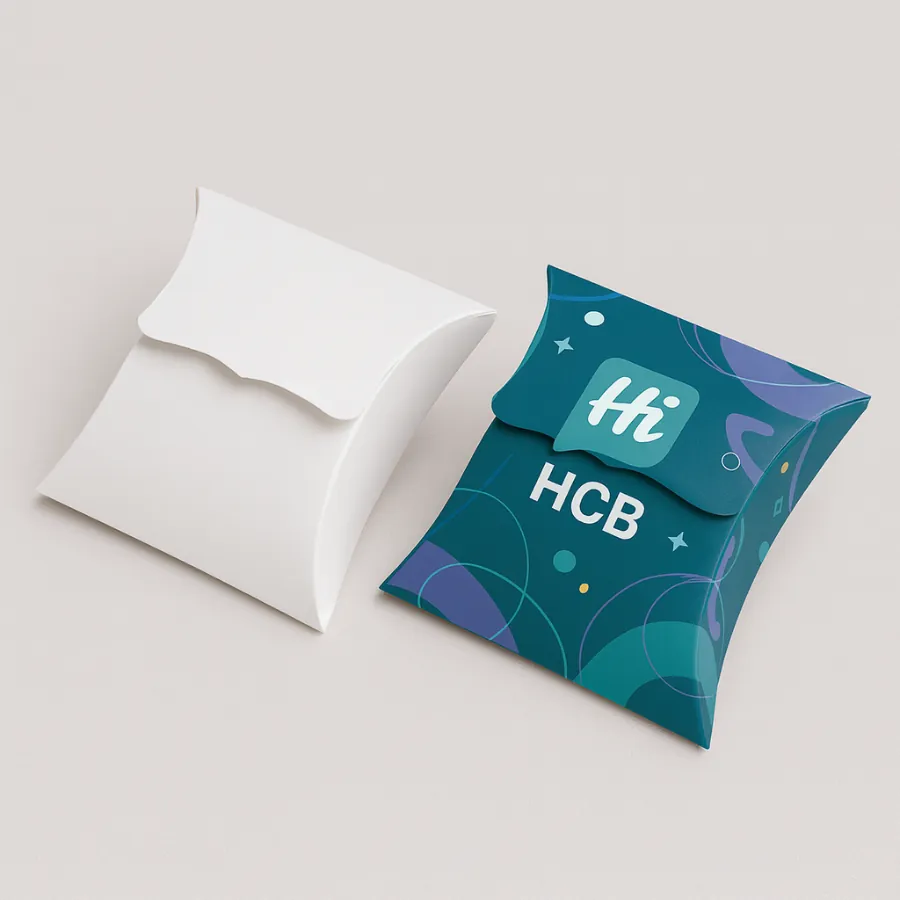 Two bespoke pillow gift boxes- one plain white and one vibrant teal with -Hi HCB- logo- class=